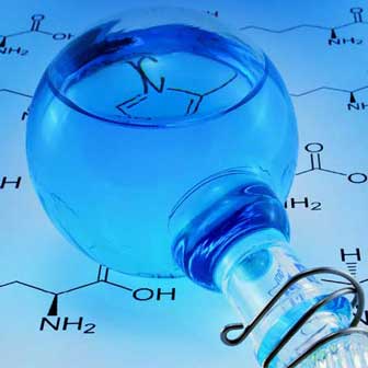 a test bulb with blue liquid over a background of a chemical equation